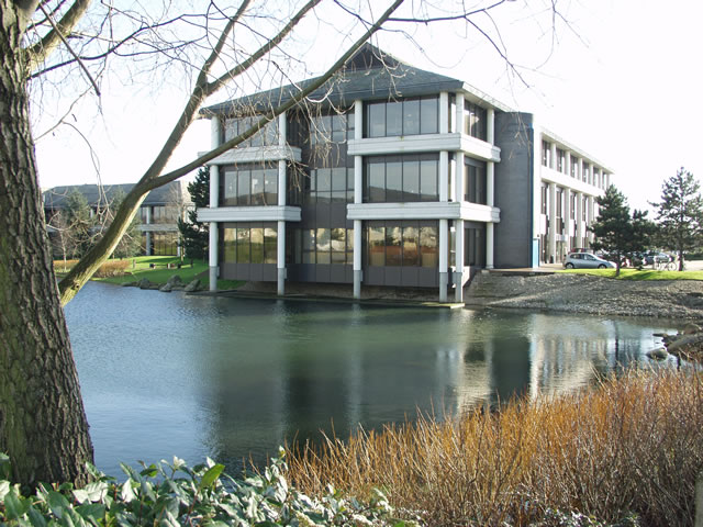The Waterside building at Arlington Business Park, beside a lake