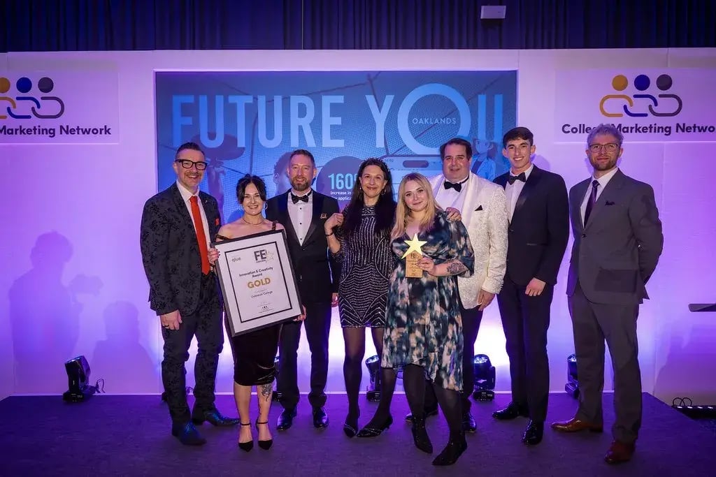The Oaklands College team on stage at the FE First Awards 2026, holding the Gold award in front of the Future You backdrop
