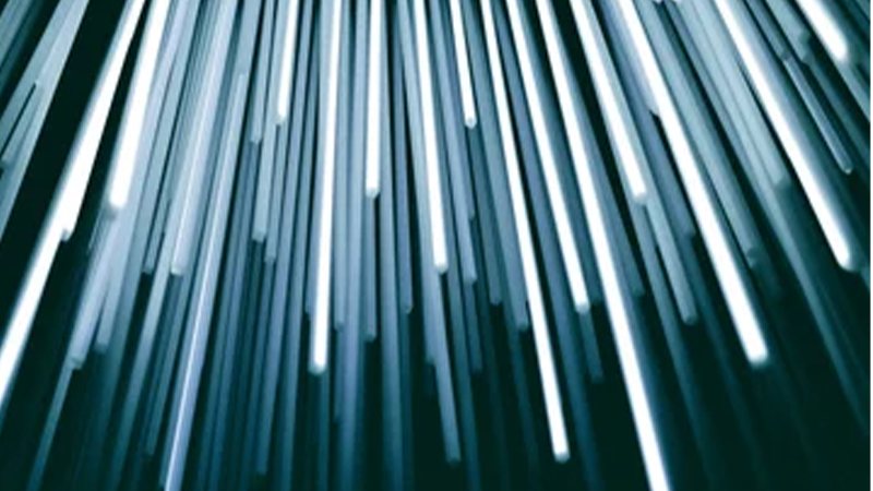 Streaks of blue and white light rushing towards the viewer, a picture of speeding up digital transformation