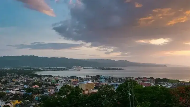 A Jamaican coastal city at dusk