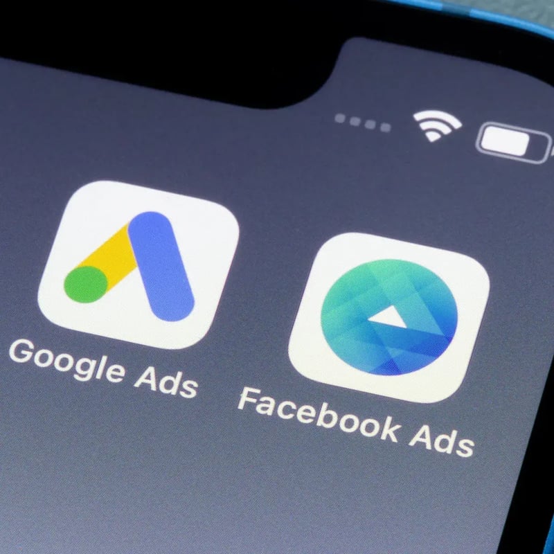 The Google Ads and Facebook Ads apps on a phone screen